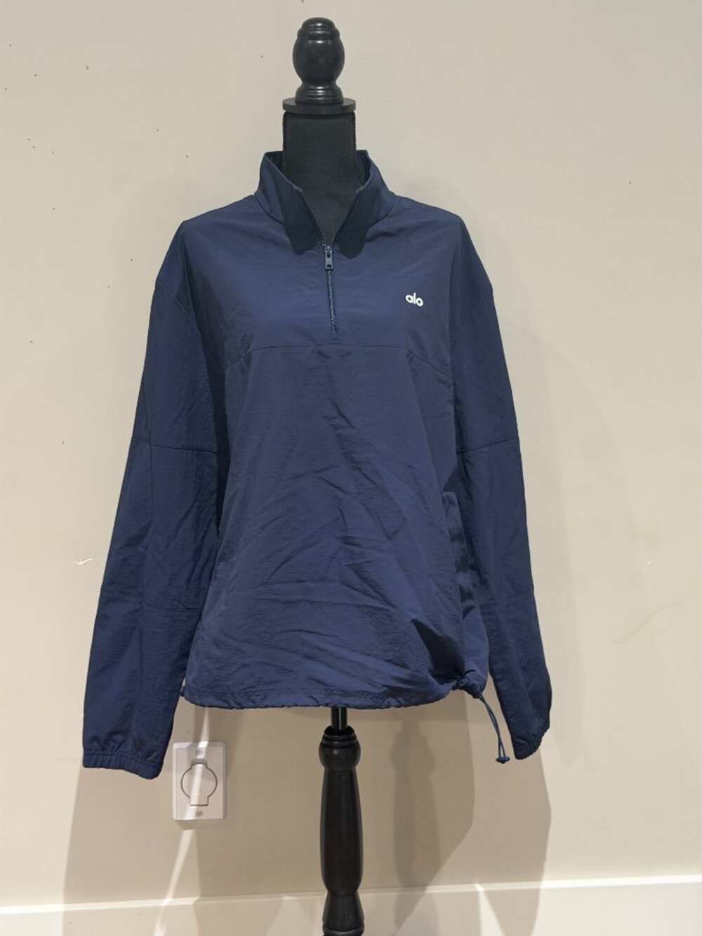 ALO Yoga lightweight half-zip windbreaker jacket in classic navy blue.